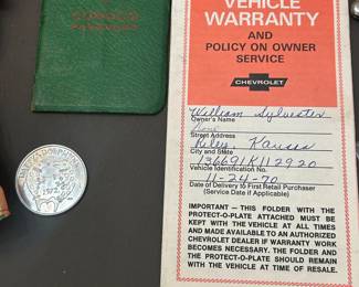 Vehicle warranty with plate