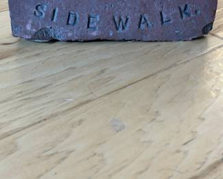 Don’t spit on sidewalk brick