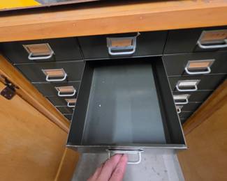 Inside of drawers of wood garage storage cabinet on wheels