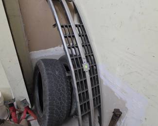 Pair of Truck Tires, a Chevy Pickup Grill and a pair of jack stands