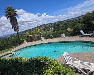 Resort-style In-ground Swimming Pool with Scenic Views