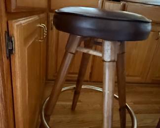 Brown Upholstered Swivel Bar Stool with Footrest Ring