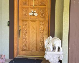 Carved Oak Entry Door with Elephant Pedestal and Figurine