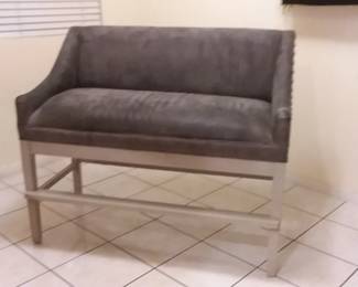 TWO suede bar height benches, heavy duty, spring loaded suspension seats