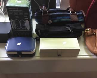 Many purses and jewelry boxes 