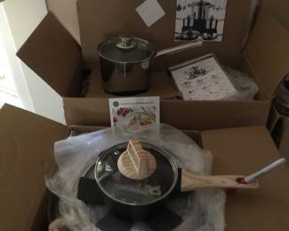 Several high quality pan sets still in boxes