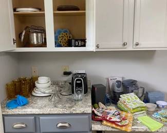 Corelle dishes, toaster, kitchen linens