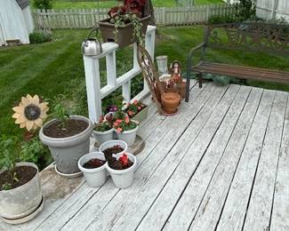 flowers and pots, metal bench