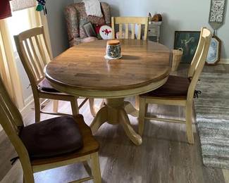 solid wood dining table with hide away leaf and four chairs