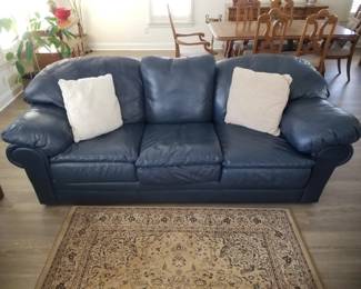 Leather couch; area rug