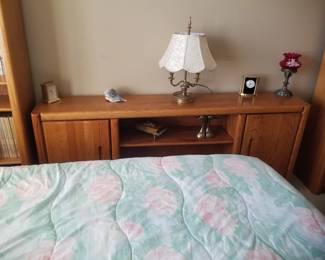 Cabinet with shelves; table lamp; clocks
