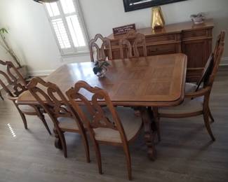 Dining set seats 8; includes custom table pads