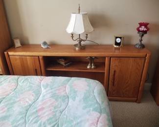 Cabinet with shelves; table lamp; clocks