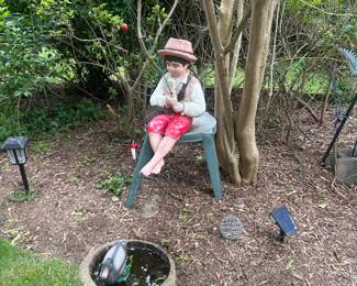 Garden statues, including antiques pieces and cement birdbaths.