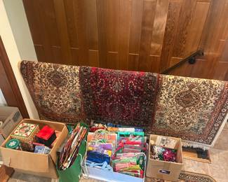Assortment of wool rugs and crafting and gift wrapping items.