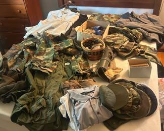 Vintage, authentic military-issued fatigues, sweaters, coats, hats, patches, as well as other gear (gas mask!).