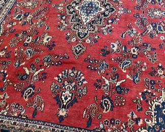 Several hand knotted Persian wool rugs throughout the home