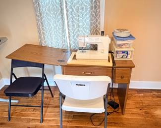 Sewing machine with table and accessories