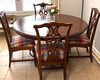 Solid wood dinning table with metal base and 4 chairs