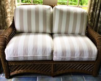 One of Two Wicker Loveseats