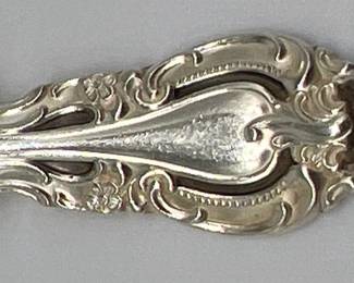 Alvin sterling silver flatware in "Vivaldi" pattern includes 7 dinner forks (7.5”L, 458g, 1 fork has bent tine), 7 salad forks (6.75”L, 308g), 7 dinner knives (9.25”L), 8 teaspoons (280g, one has shortened bowl), 2 tablespoons (101g), two butter knives, 1 salad serving fork (8.5”L, 105g), 1 gravy ladle (67g), 1 sugar shell spoon (34g), 1 casserole spoon (9”L, 103g) and pie server.