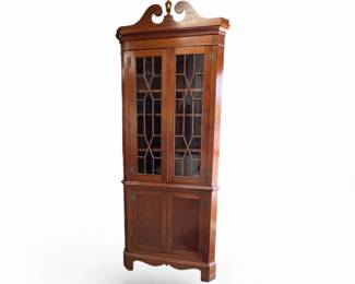 Benchmade walnut one piece small scale corner cupboard