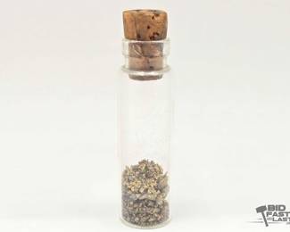 554 A Vial Of Gold Flakes
