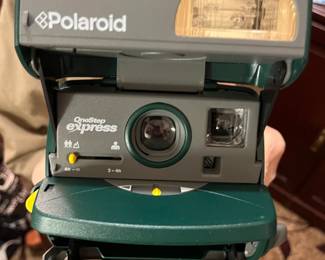 Old Polariod and 2 film cartridges