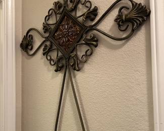 Several large iron wall hangings