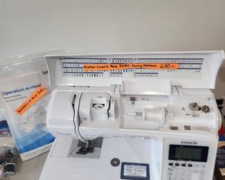 Brother Innovie pacesetter embroidery and sewing machine, accessories at front desk