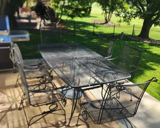 Rod iron patio set with 6 chairs