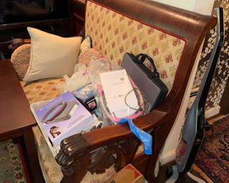 Heavily scrolled Empire style Accent Chair / Settee with Figural Lion head carving on arms