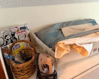 Sewing notions basket, iron and linens