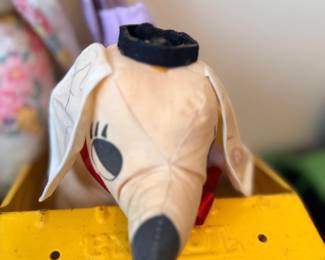 Plush animal toy on yellow wagon