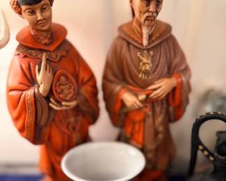 Pair of Asian robed figurines and blue-white cup