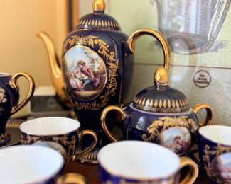 Cobalt blue and gold porcelain tea set, hand-painted scenes