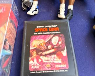 Atari Space War cartridge and basketball figures