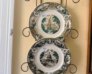 Decorative scenic transferware plates on iron rack