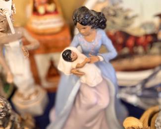 Porcelain figurine of mother holding baby
