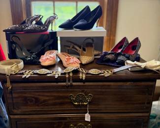 Dresser topped with shoes and jewelry