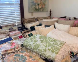 Bedroom with bed, throws and area rugs