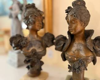 Pair of bronze female busts on marble bases