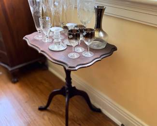 Mahogany tilt-top tripod table with crystal stemware