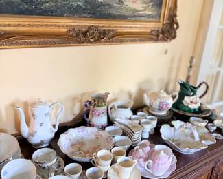 Antique floral porcelain tea sets, cups and chocolate pots