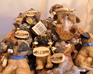 Basket of resin dog welcome figurines