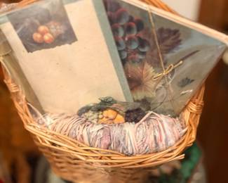 Wicker basket with framed art print and decor