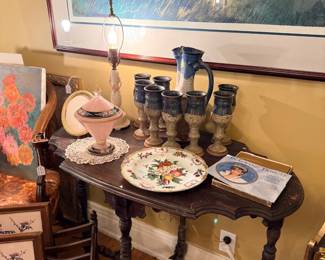 Drop-leaf table with steins, plates and collectibles