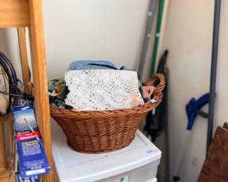 Wicker basket with linens and storage drawers