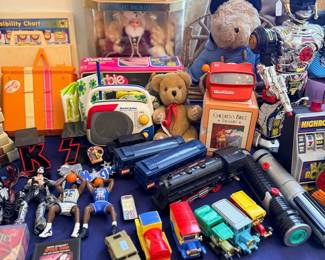 Table of vintage toys, teddy bears and toy cars