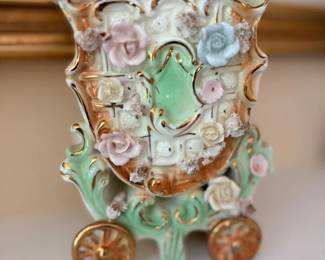 Ornate porcelain vase with applied flowers and gilt accents